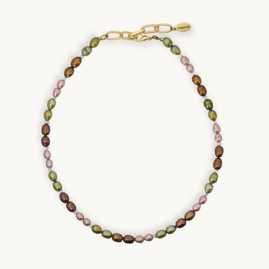 A necklace with alternating olive green, dusty pink, and brown baroque pearls, finished with a gold-tone lobster clasp and a small gold brand tag, shown on a light cream background.