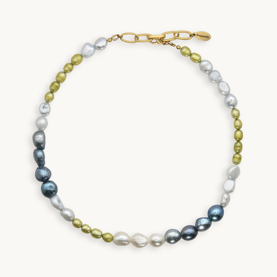 Green, blue, and white pearl necklace with a gold clasp on a white background.