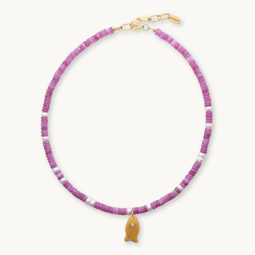 Necklace with pink beads and a gold fish charm on a white background