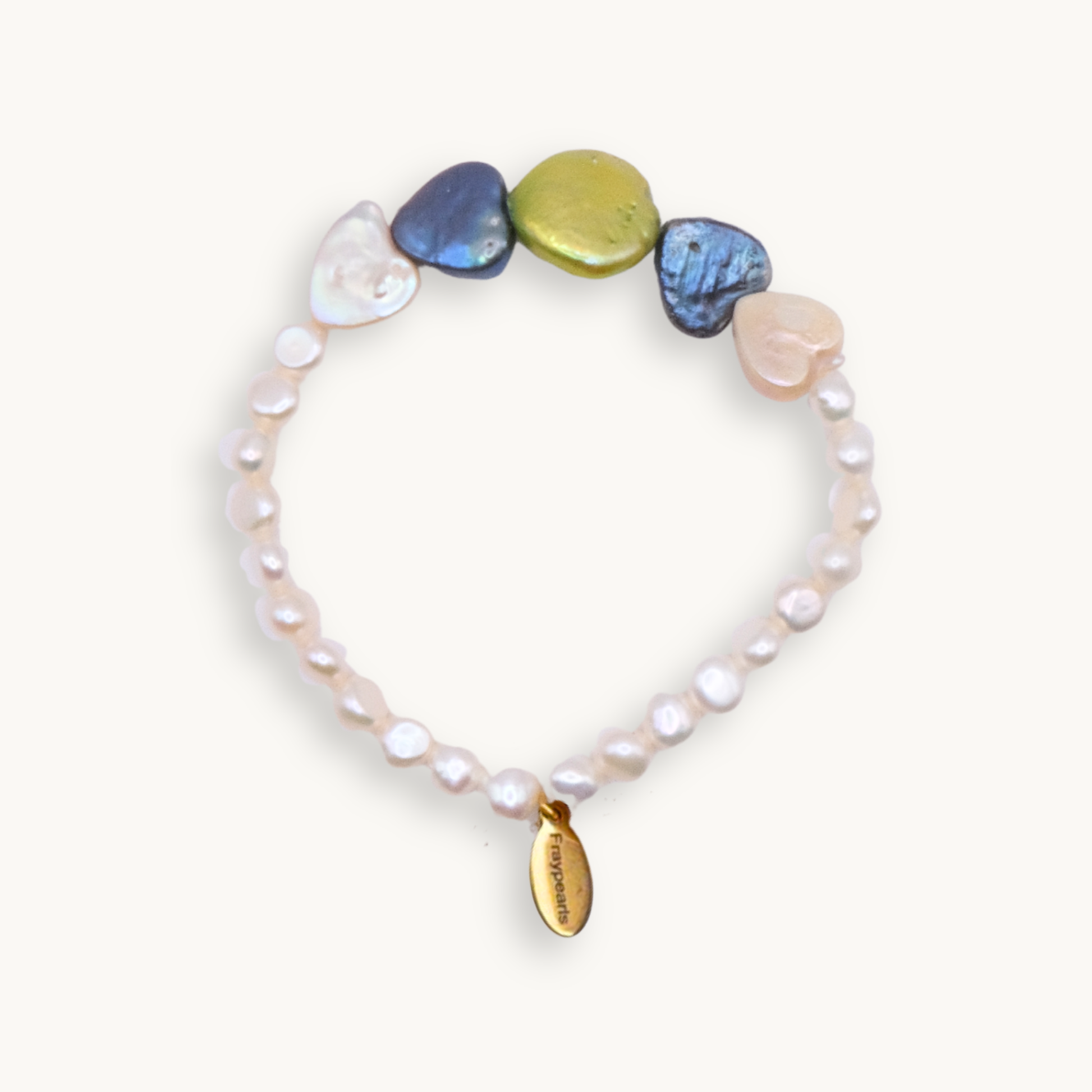 A bracelet with small white pearls and larger multicolored, irregular-shaped stones, featuring a gold tag engraved with "fraypearls," creating an elegant and colorful tone.