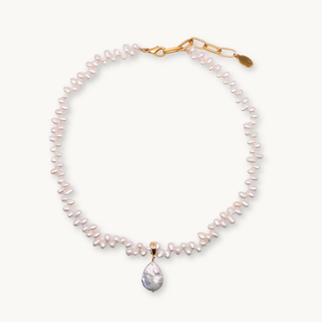Pearl necklace with a gold clasp on a white background