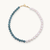Necklace with jade and white pearls on a white background
