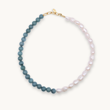 Necklace with jade and white pearls on a white background