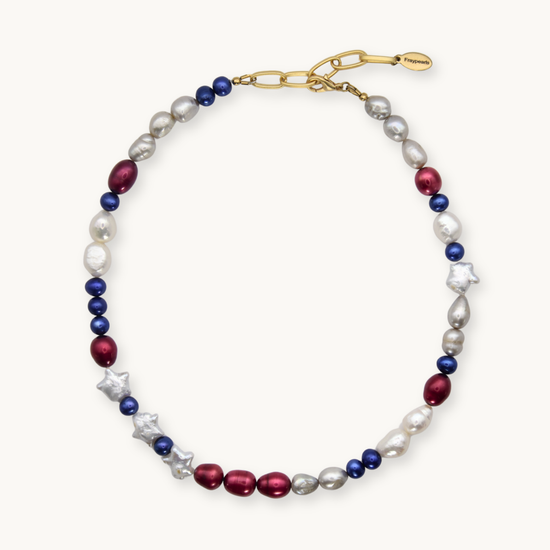 Necklace with red, white, and blue pearls and star-pearls on a white background