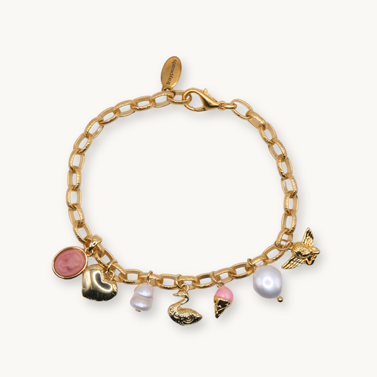 A gold charm bracelet with chain links features seven charms: a pink circle, gold horse, pearl, swan, pink ice cream, large pearl, and an angel.