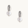 Silver and pearl drop earrings on a white background. Each earring features an irregular gold piece above a baroque pearl, giving an elegant, modern look.