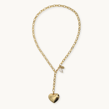 A gold chain necklace with a small heart-shaped pendant, displayed on a clean off-white background.