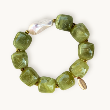 Green beaded bracelet with a gold clasp on a white background