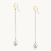 Long gold paperclip chain duster earrings with a baroque pearl drop.