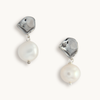 Pair of hammered silver earrings with drop pearl