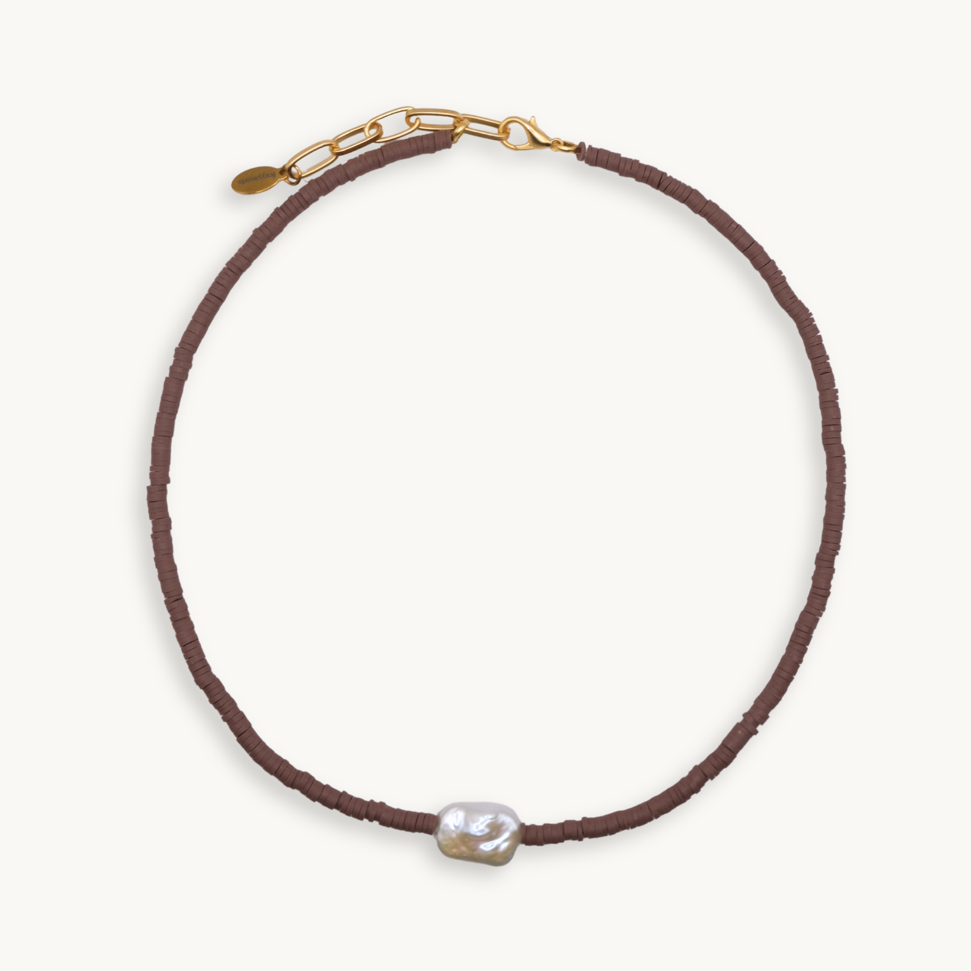 Brown beaded necklace with a pearl pendant on a white background