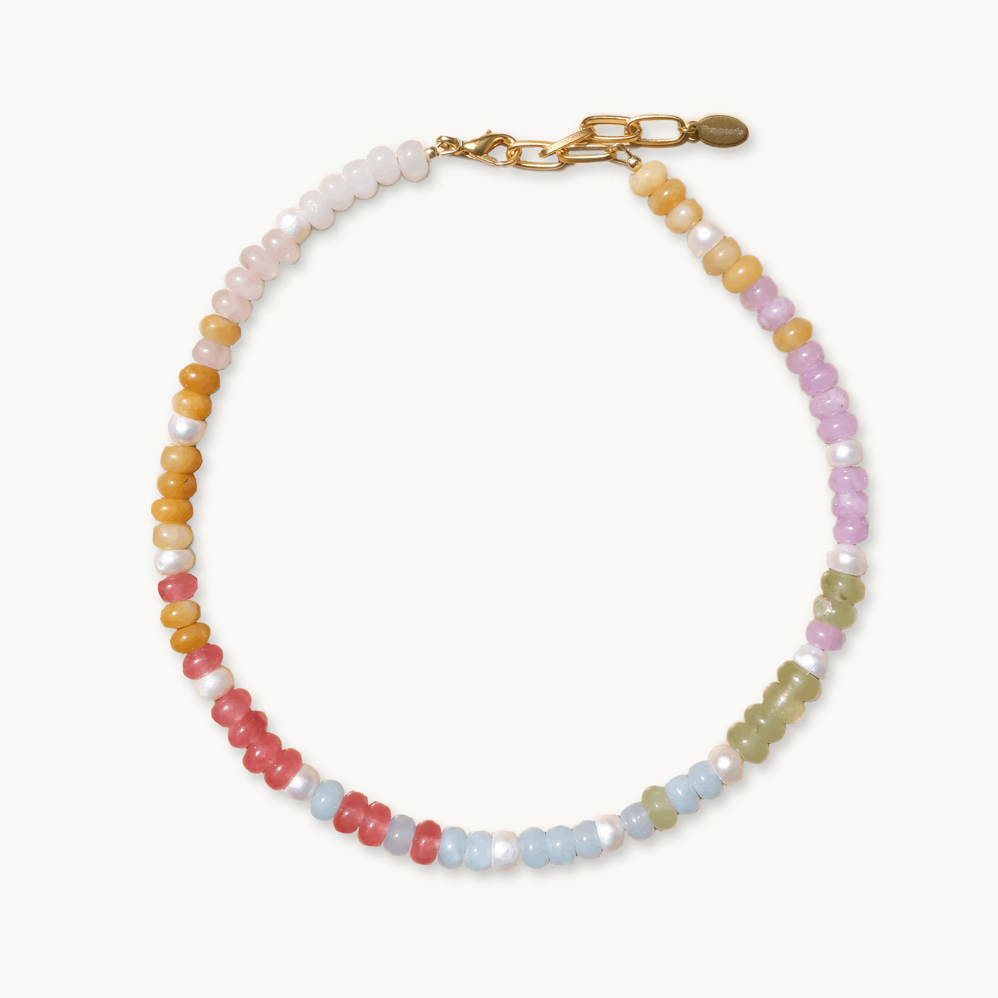 A colorful beaded necklace with pastel pink, yellow, green, and blue beads, interspersed with white pearls. It has a gold chain and clasp.