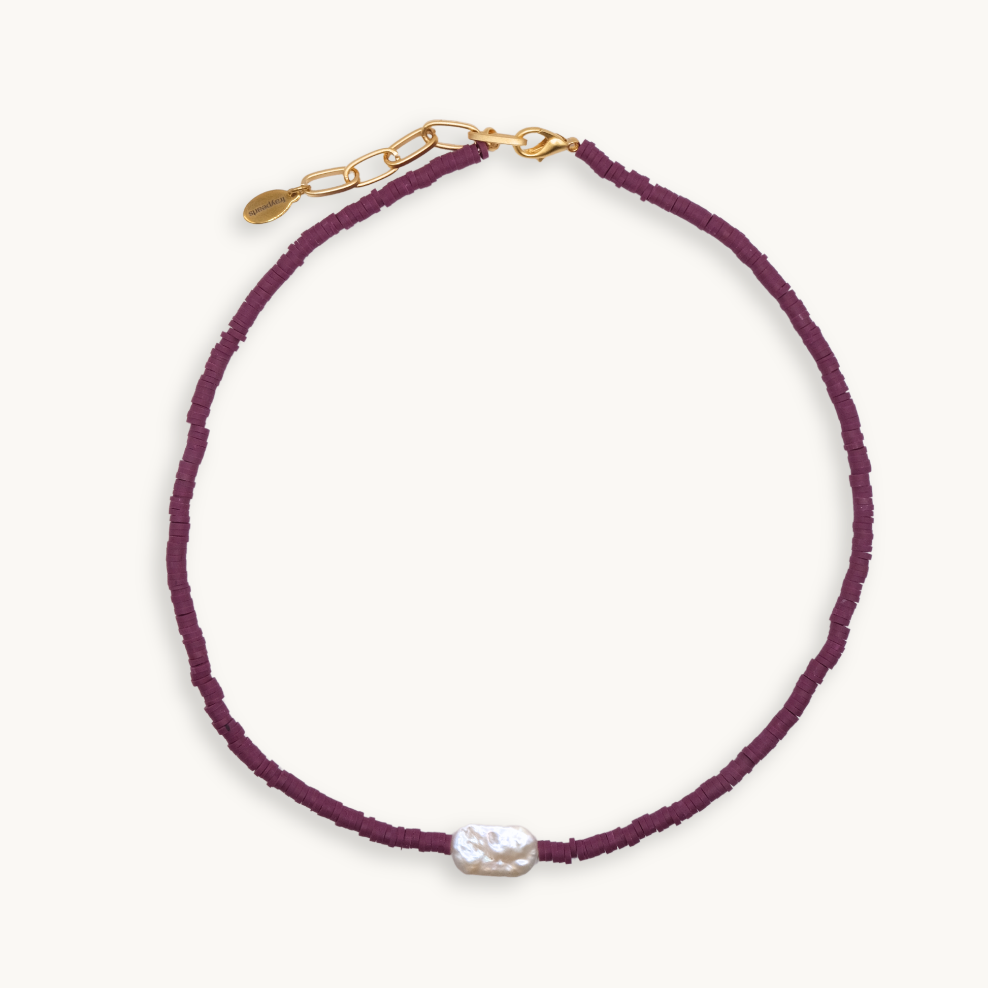 Purple beaded necklace with a pearl pendant on a white background