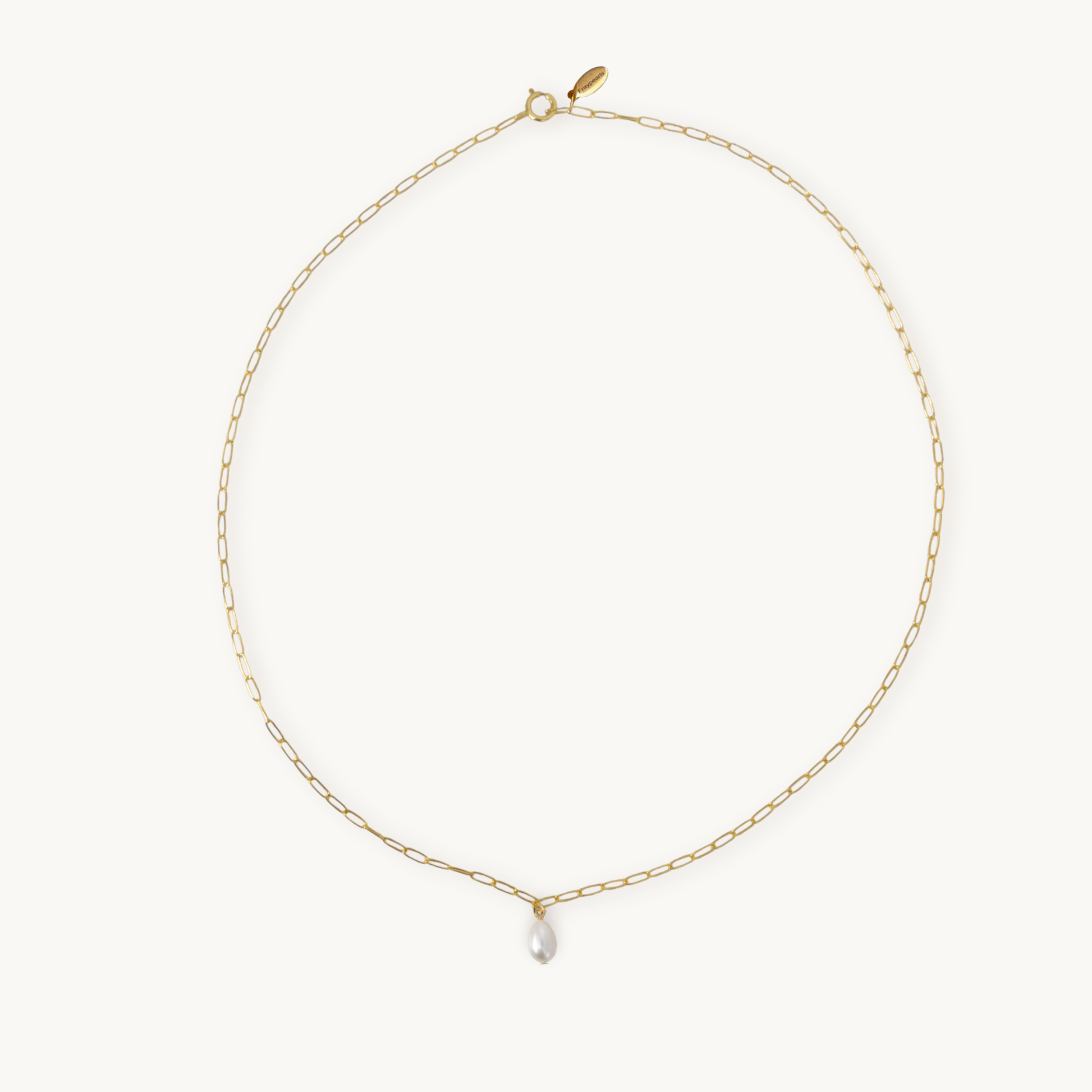 A delicate gold chain necklace with an elongated link design, featuring a shiny teardrop pearl pendant at the center, against a plain light background.