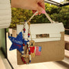 Decorative keychain with 'American Honey' star and bear design on a textured surface